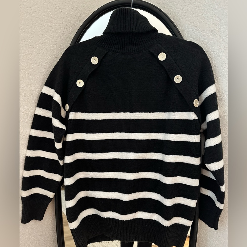 Long sleeve black and white striped sweater with buttons